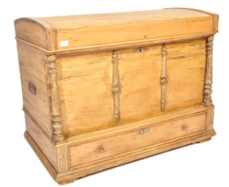 A 19th Century pine blanket box chest steamer trunk. Domed top with carved columns to the front. The hinged lid opening to re