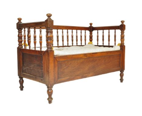 19th century Victorian mahogany cot / child's crib bench. Turned column gallery throughout with cushioned base raised on shap