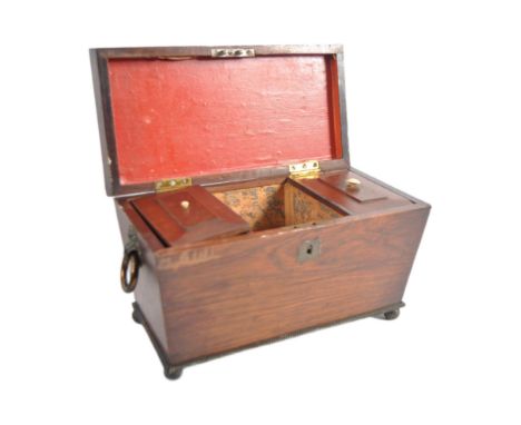 WITHDRAWN - 

A large 19th Century Regency rosewood tea caddy of sarcophagus form. The outer case of simple form having a bra