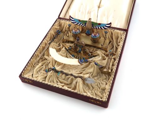 λA continental silver-gilt and enamel Egyptian revival desk set, marked 900, circa 1920, matted surface, vari-coloured enamel