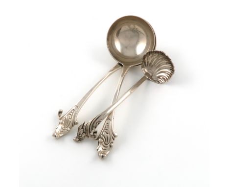 A pair of George III Rococo sauce ladles, by Eley, Fearn and Chawner, London 1810, circular bowls, the Rococo terminals with 