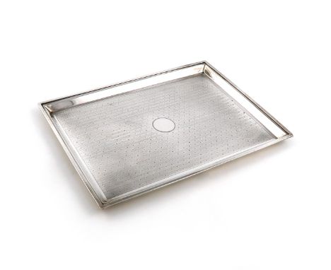 A silver dressing table tray, by William Neale and Sons, London 1911, rectangular form, engine-turned decoration, central vac