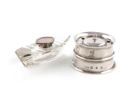 A Victorian silver inkwell, by John Grinsell &amp; Sons, Birmingham 1892, capstan form, with a hinged cover and glass liner, 