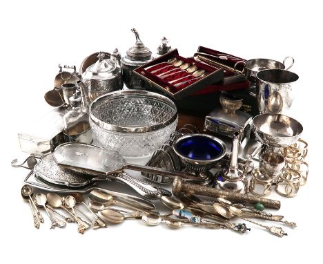 λA mixed lot, comprising silver items: a silver-mounted glass bowl, seven napkin rings, a small trophy, a salt cellar, three 