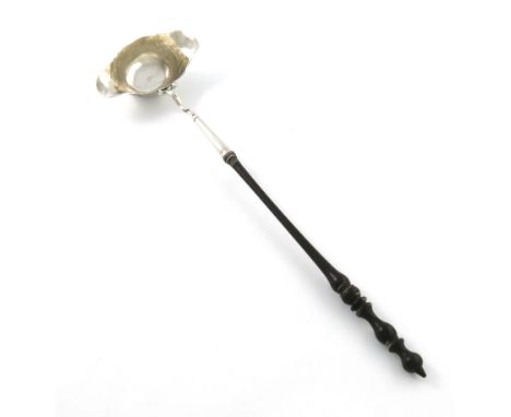 A George II Irish silver punch ladle, maker's mark lost in decoration, circa 1750, double lipped oval form, chased foliate sc