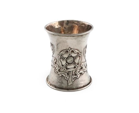 By Omar Ramsden and Alwyn Carr, an Edwardian Arts and Crafts silver napkin ring, London 1908, circular waisted form, spot-ham