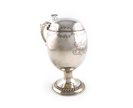 An unusual George III silver tankard, maker's mark partially worn, ?K, London 1771, ovoid form, engraved foliate borders, lea