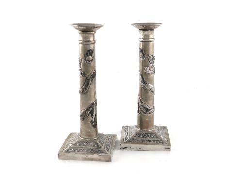 A pair of Chinese silver candlesticks, retailed by Wang Hing, tapering circular columns, mounted with a spiral snake, detacha