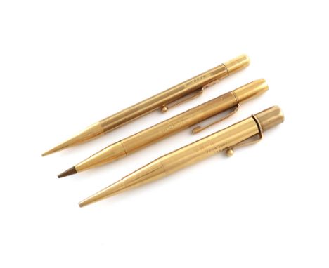 Three 18 carat gold pencils, comprising: a Mabie Todd propelling pencil with clip, engine-turned body, the cartouche engraved