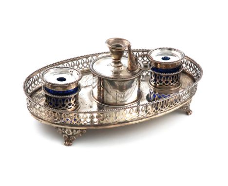 An Edwardian silver inkstand, by George Leonard Allen, London 1909, oval form, pieced gallery with a bead border, with a cent