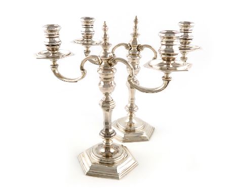 A pair of modern silver two-light candelabra, by R. Comyns, London 1973, in the George I manner, octagonal baluster stems, sp