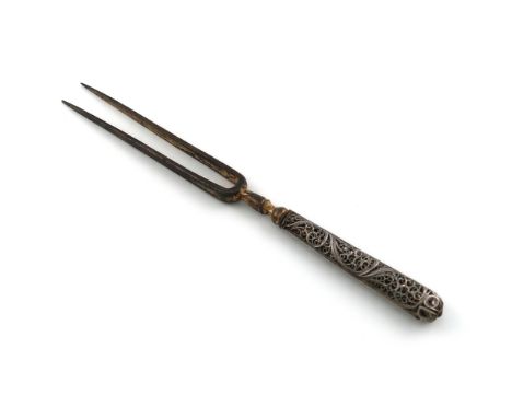 A late 17th century silver handled two-pronged fork, circa 1680, tapering filigree handle, the steel prongs with traces of gi