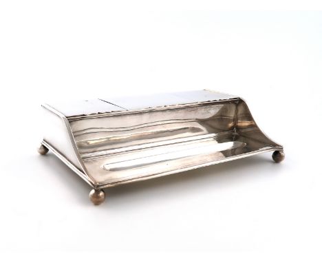 A silver inkstand, by Carrington and Co., London 1913, rectangular form, with three hinged compartments, two with clear glass