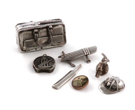 A small mixed lot of cricket related items, comprising silver items: a modern miniature cricket bag, pads, bat and cap, by R 