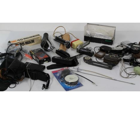 Large selection of camera accessories including light meters, flash meters, remote shutter cables, hand grips, power drive, t