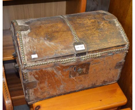 A Nineteenth Century part hide cupboard domed topped trunk with decorative metalwork