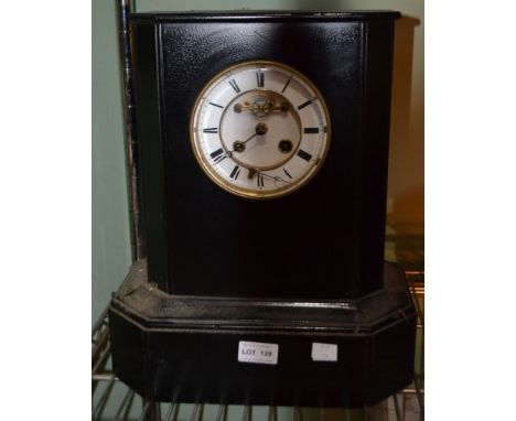 A large black slate mantel clock