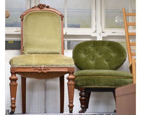 A late Victorian button back nursing chair together with a carved oak framed single chair