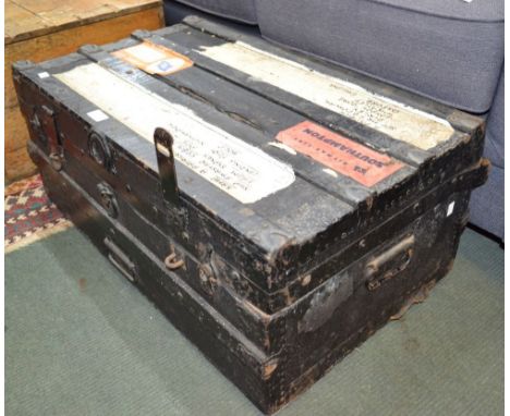 An early 20th century metal bound traveling trunk