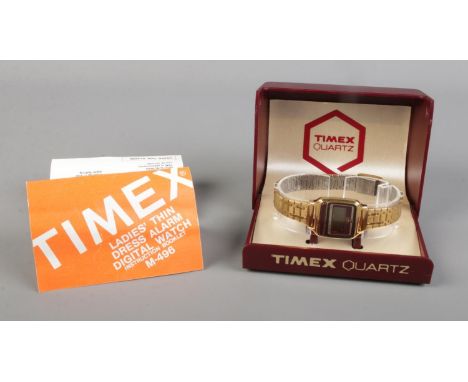 A ladies Timex quartz dress alarm digital wristwatch, in box with booklet.  