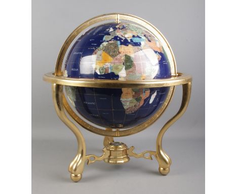 A large modern gemstone globe, comprising of countries being composed of minerals and semi-precious stones. With compass buil