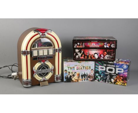 A Spirit of St.Louis Rock N Roll radio and tape jukebox, together with three box set CD's; 30 Years of Pop, Sixties and Seven