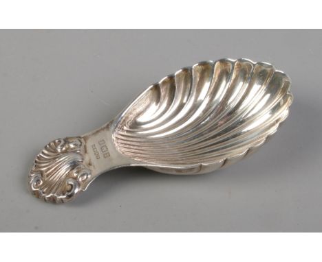 An A Marston &amp; Co Birmingham silver caddy spoon in the form of a seashell. Hallmarked date indistinct. Weight 20.85g.  