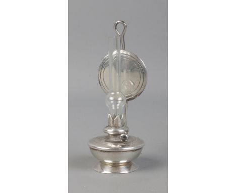 A miniature silver oil lamp figure, stamped 925 to reverse. Approx. height 7.5cm. Silver weight 26.94g.  
