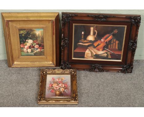 Two framed still life oil paintings and one similar print example. Includes violin with sheet music example, etc.  