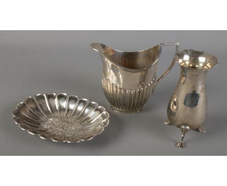 Three pieces of silver. Includes trinket dish with repousse decoration, Mappin &amp; Webb jug and small vase. 202g.  