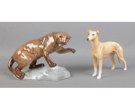 A Beswick model of a Greyhound, titled 'CH Jovial Roger', together with a Beswick puma (No. 1823).  