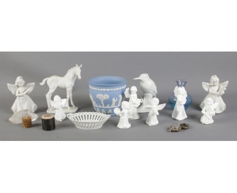 A small collection of assorted items, to include ceramic cherub figures, Wedgwood jasperware vase, and white metal coin holde