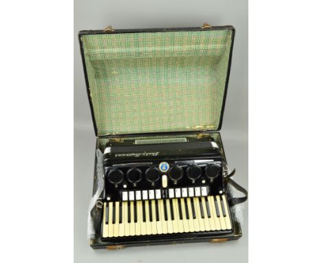 A PAOLO SOPRANI PIANO ACCORDION, with 120 buttons, 41 treble keys, finished in black, with a carry case with worn interior (c