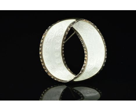 A NORWEGIAN ENAMEL BROOCH BY ANDERSEN AND SCHEINPFLUG, designed as an open overlapping circle, the white enamel with floral g