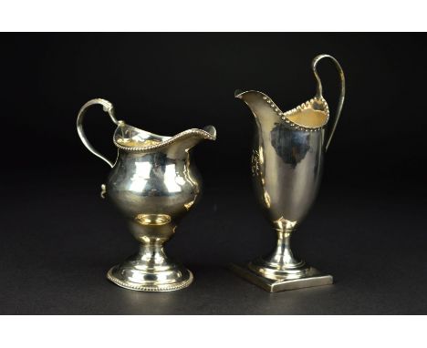 A GEORGE III SILVER HELMET SHAPED PEDESTAL CREAM JUG, crimped rim, engraved initial under lip, on a square foot, maker possib