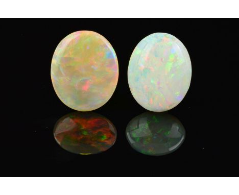 TWO OPAL OVAL CABOCHON CUT STONES, one measuring 20mm x 17mm, one measuring 20mm x 17mm, total weight 14.23ct, grey base colo