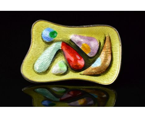 A NORWEGIAN ENAMEL BROOCH BY OYSTEIN BALLE, of curved rectangular outline, embossed with abstract shapes in various colours t