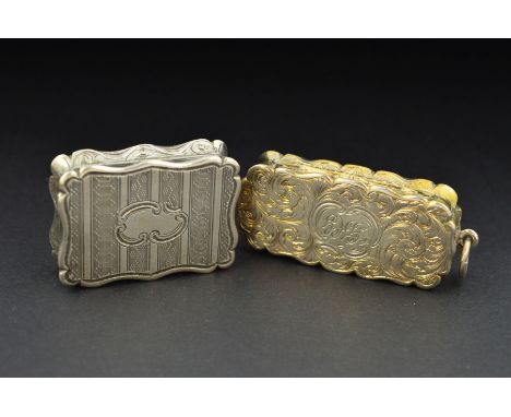 TWO VICTORIAN SILVER VINAIGRETTES, of wavy rectangular form, one engraved with foliate scrolls and with loop attachment, engr