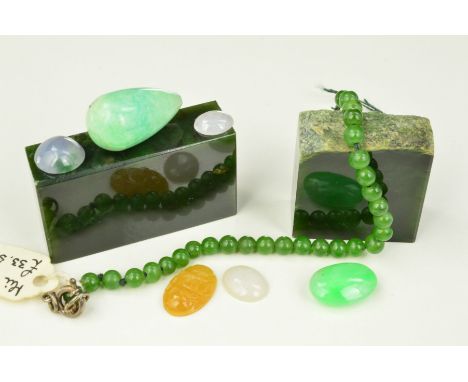A COLLECTION OF JADEITE AND NEPHRITE JADE, mixed colours to include pale green, brownish yellow, lilac and white jadeite cabo