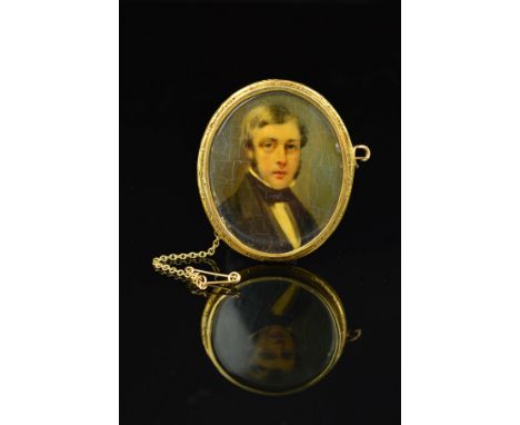 A LATE 19TH CENTURY GOLD PORTRAIT MINIATURE, of an unknown gentleman in classical attire, oval shape measuring approximately 