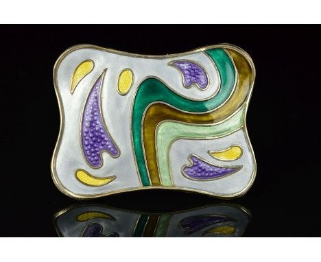 A NORWEGIAN ENAMEL BROOCH BY OYSTEIN BALLE, of shaped rectangular outline, the abstract pattern comprising of elongated purpl