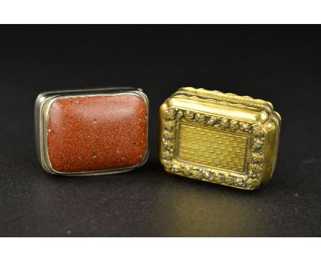 A GEORGE III SILVER RECTANGULAR VINAIGRETTE, the hinged cover inset with a goldstone panel, gilt interior with filigree heart