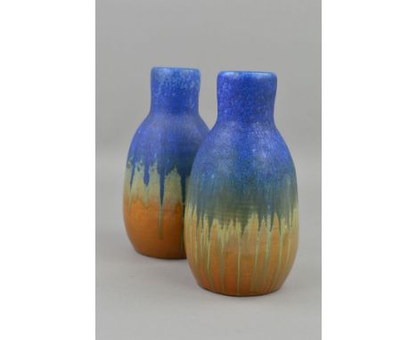 A PAIR OF RUSKIN A9 SHAPED VASES, with a matt blue glaze over a gloss orange, impressed Ruskin England 1927 to the base, heig