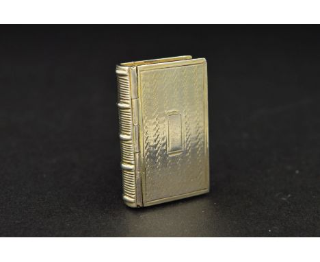 A WILLIAM IV SILVER NOVELTY VINAIGRETTE, of book form, engine turned decoration, blind rectangular cartouche, gilt interior, 