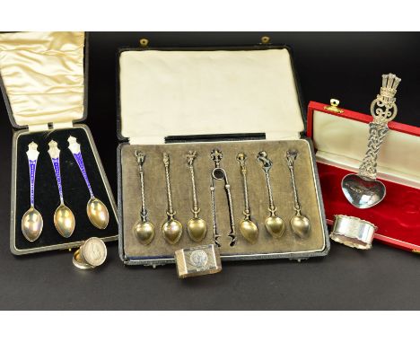 A CASED SET OF THREE GEORGE V, EDWARD VIII AND GEORGE VI SILVER, SILVER GILT AND ENAMEL COMMEMORATIVE TEASPOONS, makers A.J. 