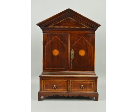 A GEORGE III STYLE MAHOGANY AND INLAID MINIATURE CABINET, of architectural form, the double doors enclosing a single shelf, t