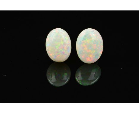 TWO OPAL OVAL CABOCHON CUT STONES, measuring 16mm x 12mm, total weight 12.57ct, grey base colour with rolling flash colours o