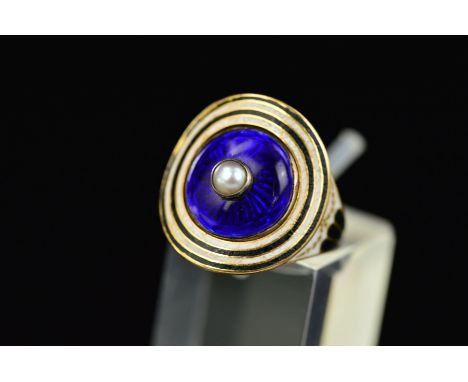A GEORGIAN GOLD RING, set with latter added Victorian blue enamelled disc with a pearl centre, shoulders decorated with white