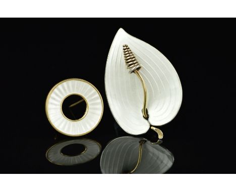 TWO NORWEGIAN ENAMEL BROOCHES BY EINER MODAHL, the first a stylised white enamel lily, the second a circular white enamel sha