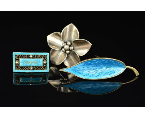 THREE SCANDINAVIAN DESIGNER BROOCHES, the first a light blue guilloche enamel leaf by Meka, the second a flower head by E. Dr